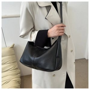 Minimalist black PU leather hobo tote bag with adjustable strap for women in 2023 winter style
