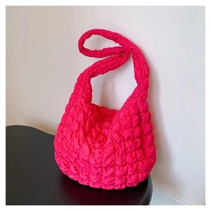 Detail of hot pink puffer hobo bag with cloud pleats and quilted texture detail