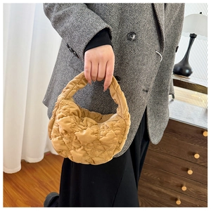 Detail of a khaki quilted cloud bag showing soft texture and rhombus stitching
