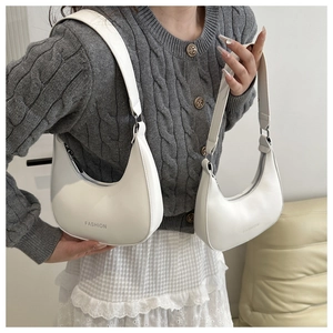 Detail of white PU leather hobo bags with FASHION logo in two different sizes
