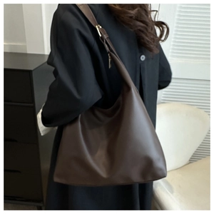 Deep brown minimalist faux leather tote bag showing large capacity and smooth texture