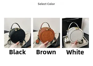 Detailed view of embossed floral patterns and woven shoulder straps on round PU bags