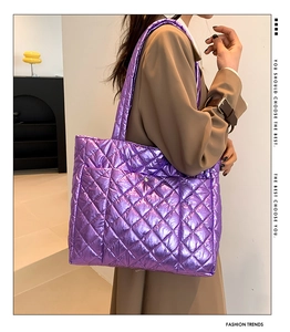 Detail of purple metallic quilted tote bag with diamond stitching and large capacity