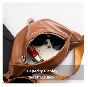 Interior view of brown PU leather bag showing space for sunglasses and power bank