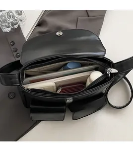 Top view showing the spacious interior of the black leather shoulder bag for daily items