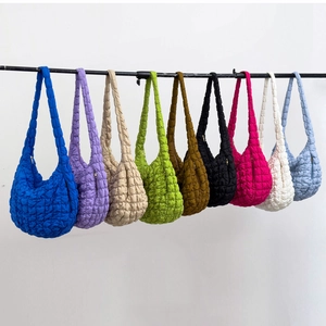 Quilted cloud bag in nine vibrant colors with pleated puffy texture and shoulder strap