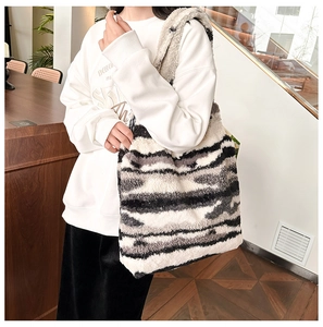 Detail of soft plush zebra pattern tote bag featuring high-quality faux fur texture