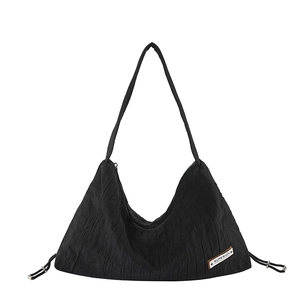 Minimalist black pleated underarm bag with zipper closure and side drawstring details