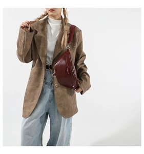 Deep wine red crescent shoulder bag detail with glossy finish and silver metal buckles