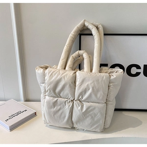 Chic off-white quilted puffer tote bag in premium matte nylon with a modern puffy design