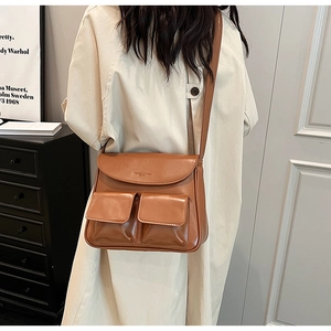Fashionable brown PU leather crossbody bag with dual front flap pockets and strap