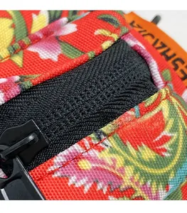 Detail of floral canvas bag showing heavy-duty black zipper and fine woven texture