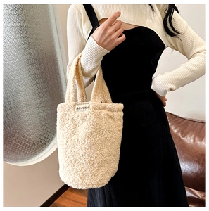 Winter faux shearling handbag in off-white plush fabric with a minimalist woven label
