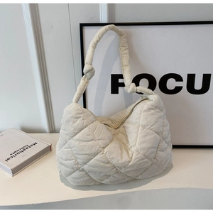 Minimalist beige quilted puffer shoulder bag with stylish knotted strap detail