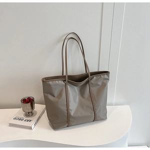 Minimalist large nylon tote bag in taupe with long shoulder straps for daily use