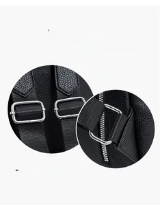 Detailed macro view of silver metal buckle on black lychee grain leather backpack strap