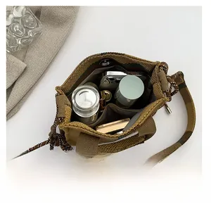 Top down view of spacious canvas bucket bag interior showing daily essentials storage