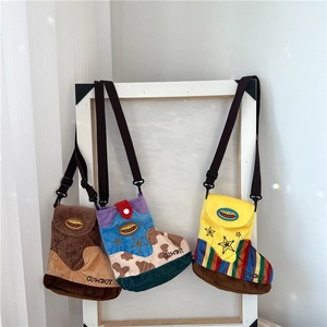 Three plush cowboy boot cross-body bags with star embroidery and cowboy lettering detail