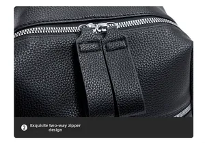Detail of premium silver dual metal zippers on black lychee grain faux leather backpack