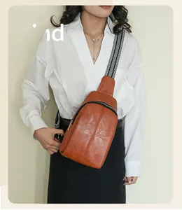 Brown PU leather chest bag with black and white geometric striped strap for street fashion