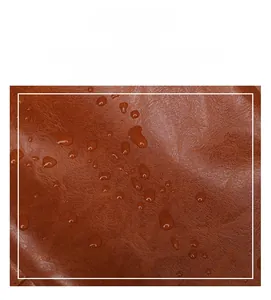Close-up of waterproof brown faux leather fabric showing high density and smooth texture