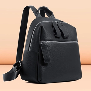 Fashionable black pebbled leather backpack with multi-pocket design and silver zippers