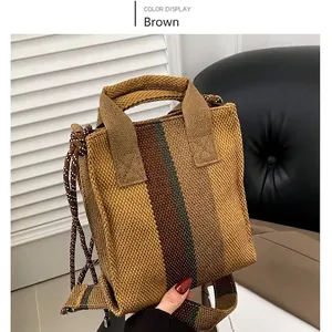 Winter striped knit handbag in brown and green with adjustable crossbody strap