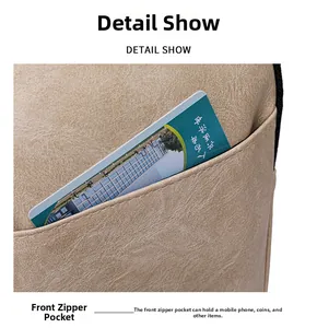 Vue détaillée de la poche avant zippée sur un sac à main en tissu beige avec rangement
