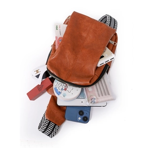 Internal view of the brown lychee pattern crossbody bag showing high storage capacity