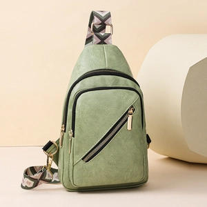 Sage green PU leather crossbody bag with golden zippers and geometric patterned strap