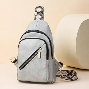 Light gray fashion crossbody bag with geometric fabric strap and gold hardware accents