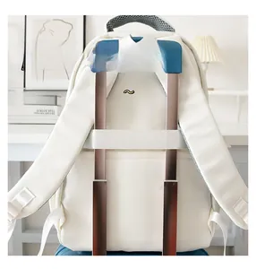 Detail showing the back luggage strap of a canvas fashion backpack for travel