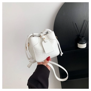 White mini bucket bag in crocodile embossed faux leather with drawstring and golden strap