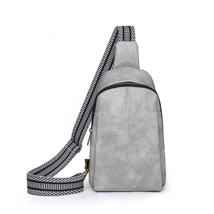 Gray textured PU leather sling bag with stylish black and white woven wide shoulder strap