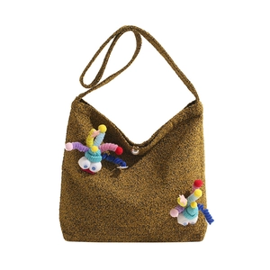 Winter crossbody bag in brown tweed with a pearl clasp and colorful plush charm detail