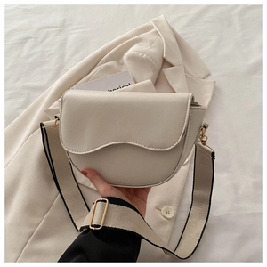 Minimalist beige PU leather shoulder bag with curved flap and wide canvas strap
