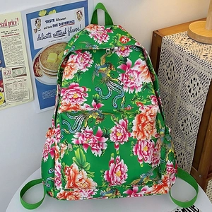 Mochila de nailon verde con patrones tradicionales chinos de fénix y peonías