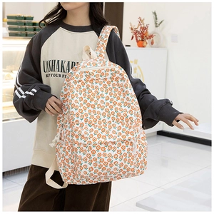 Détail du sac à dos d'hiver en tissu Oxford avec motif floral orange et poche zippée