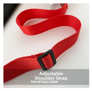 Detailed view of the bright red woven adjustable shoulder strap with black matte buckle