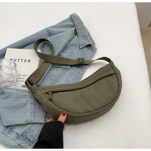 Army green nylon half-moon crossbody bag with adjustable strap and functional storage
