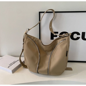 Minimalist khaki nylon hobo bag for women featuring stylish dual vertical zippers and wide strap