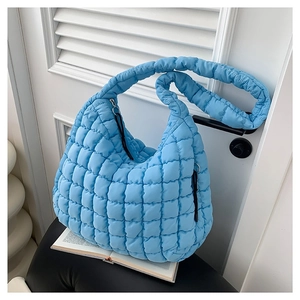 Quilted light blue cotton cloud bag for women with padded shoulder strap and soft texture