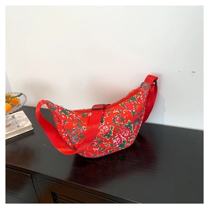 Floral nylon crescent bag in red peony print with adjustable shoulder strap for women
