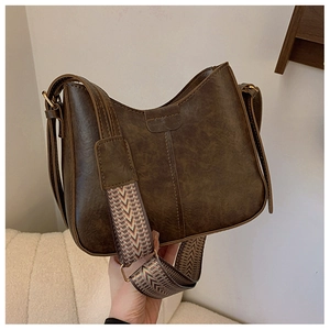 Vintage dark brown PU leather saddle bag with colorful bohemian jacquard shoulder strap