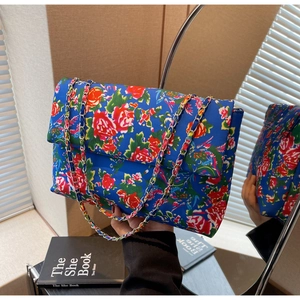 Fashionable floral canvas crossbody bag with blue base and vintage peony patterns