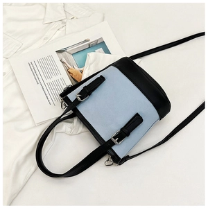 Fashion bucket crossbody bag in light blue and black PU leather with metal buckles