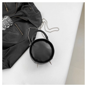 Minimalist black PU leather round crossbody bag with silver bead chain and metal spikes