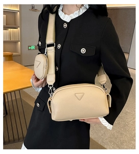 Detail of light beige PU leather crossbody bag with detachable mini pouch and wide strap