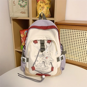 Fashionable nylon color-block backpack with cartoon prints and star pendant accessory