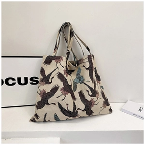 Minimalist canvas tote bag featuring traditional crane embroidery and sturdy double handles